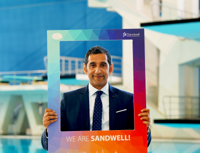 Shokat Lal holding We Are Sandwell board