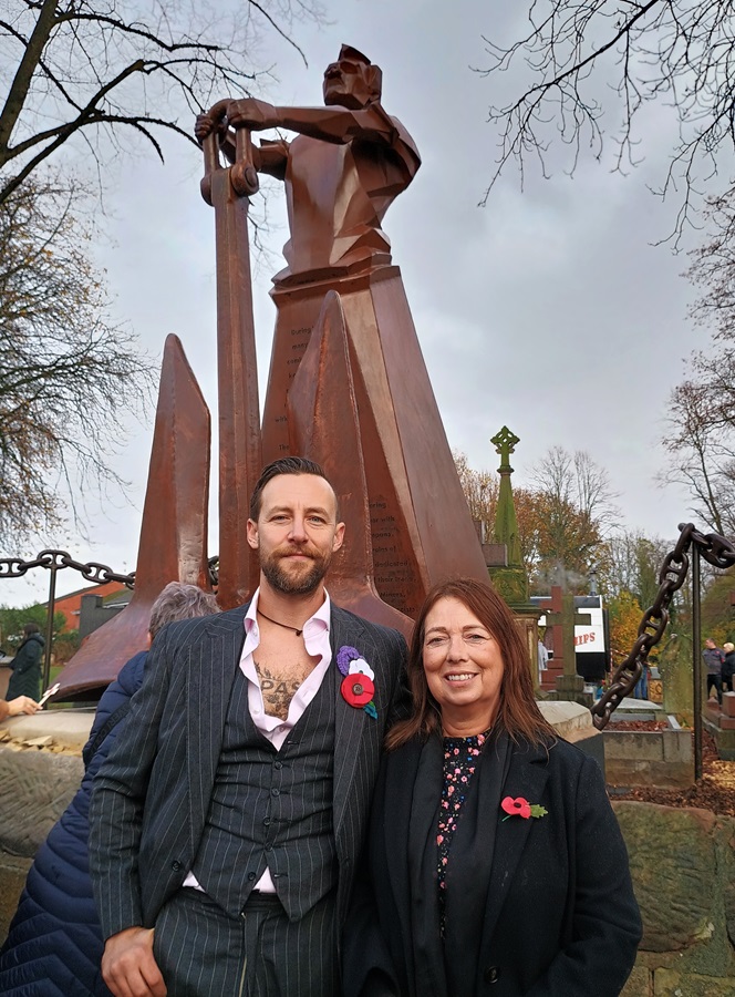Sculptor Luke Perry and Councillor Kerrie Carmichael at the unveiling of the Fighting from Home monument in St Luke's Churchyard, Cradley Heath, November 2025