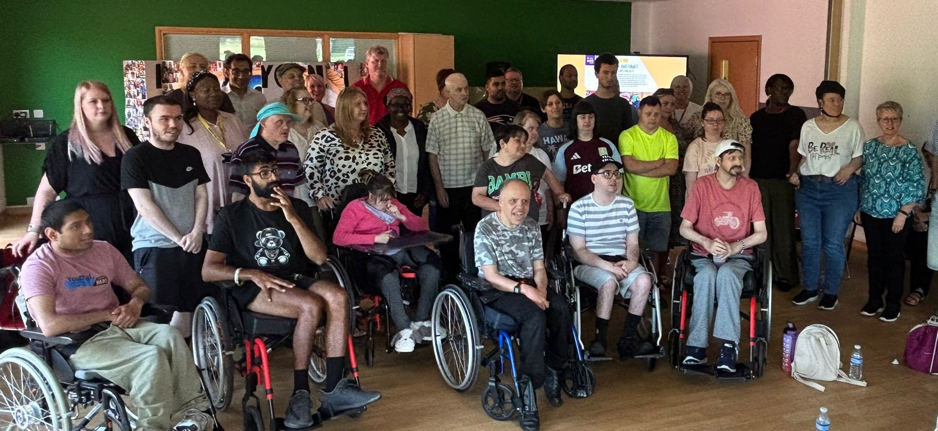 Our Disability Services staff and individuals smile in a group photo
