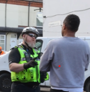 Enforcement officer talking to a member of the public