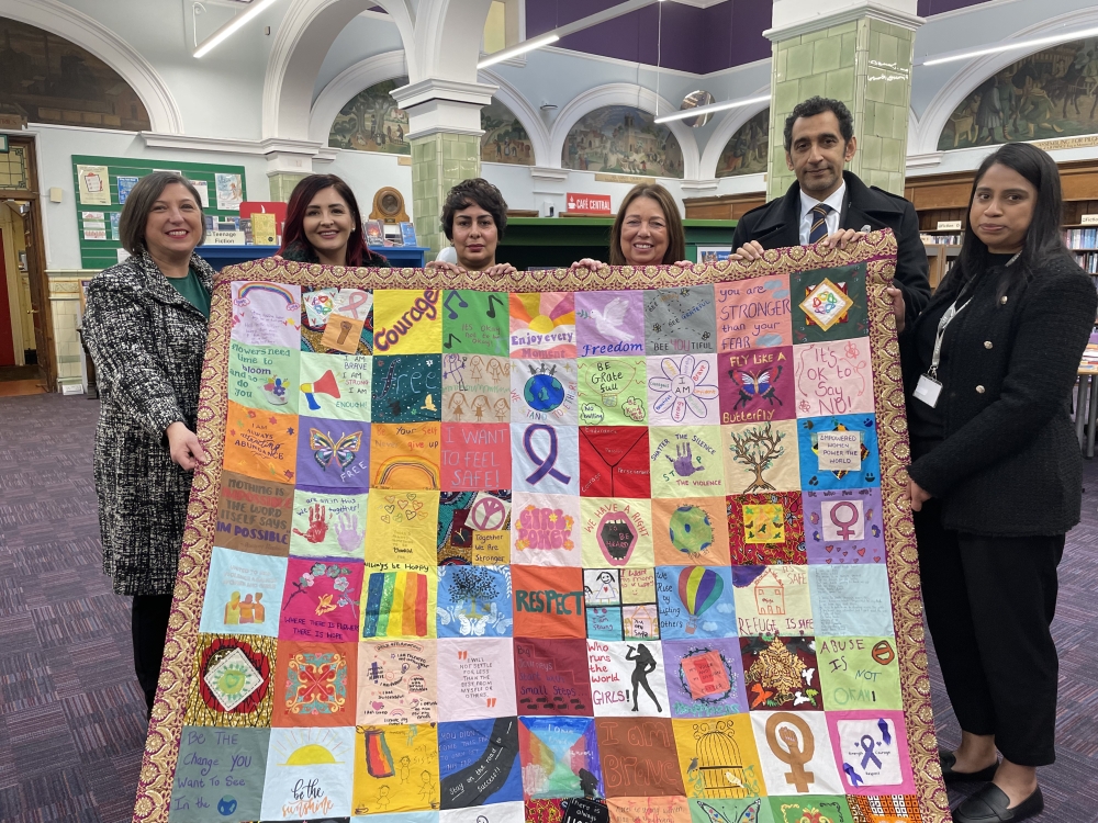 Representatives from Sandwell Council and Black Country Women&#039;s Aid pictured with the Quilt of Hope