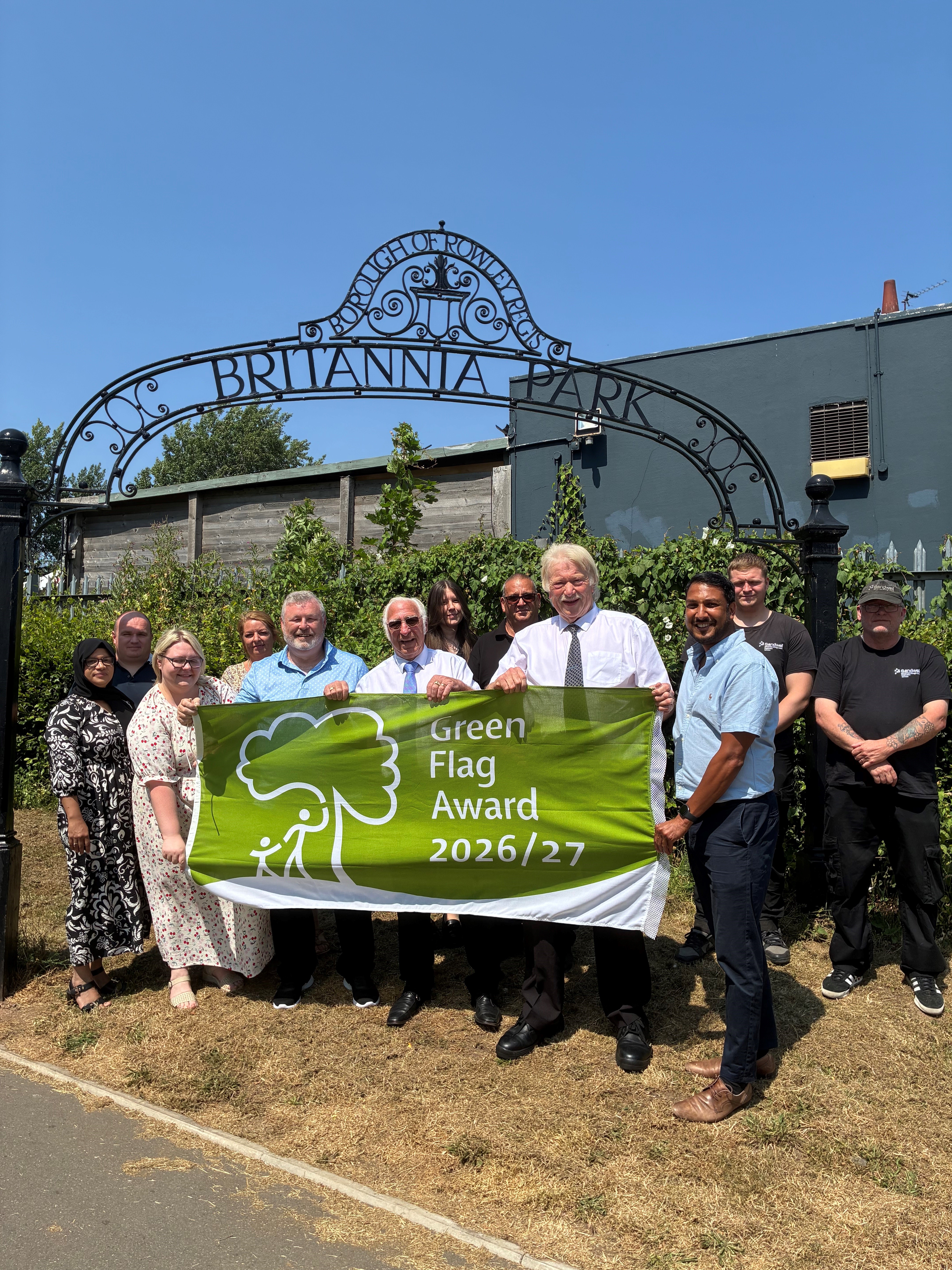 Leader of Sandwell Council, Councillor Ray Nock and Cabinet Member for Environment and Enforcement Councillor Bob Jones (Both with ties) together with staff from the council's Green Space, Bereavement Services and Town’s Fund teams