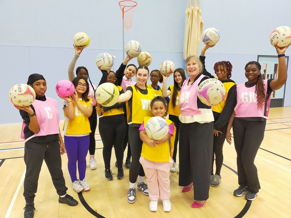 Helping to launch the new website, Daisey Cotterill, Founder and Director of AnyGirl Netball CIC, and Alice Davey, Sandwell Council&#039;s Director of Borough Economy, with netball players from AnyGirl Netball CIC at West Bromwich Leisure Centre
