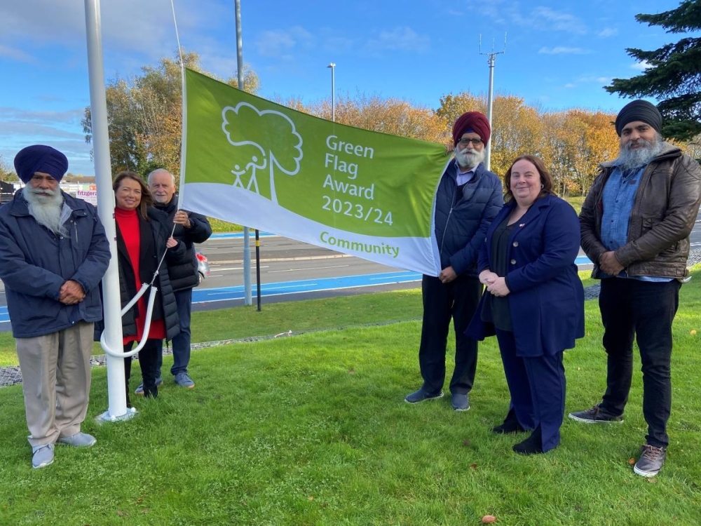 A flag has been raised at the Lions of the Great War statue site in recognition of its long-standing Community Green Flag status and to mark five years since the official unveiling.