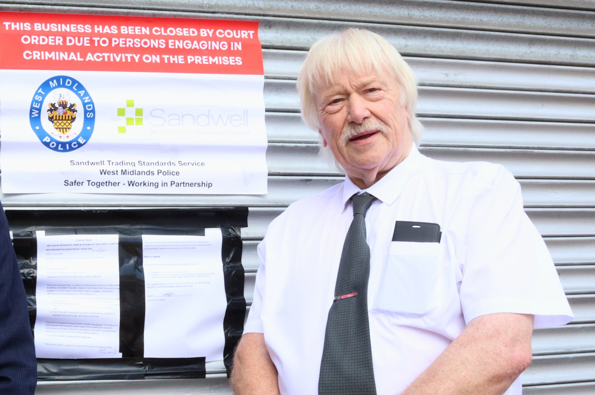 Leader of Sandwell Council Councillor Ray Nock outside one of the closed shops