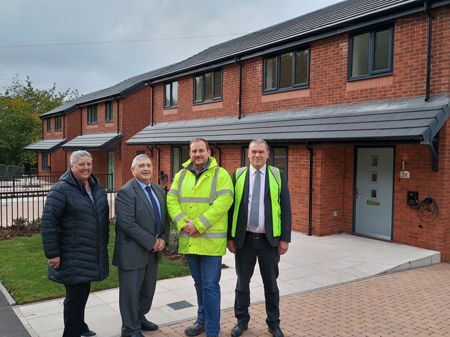 At one of the new four-bedroom homes in Higham’s Close, left to right, Rachael Snade (Sandwell Council), Councillor Peter Hughes (Sandwell Council), Richard Pincher (Welch and Phillips Building Contractors) and Alan Martin (Sandwell Council)