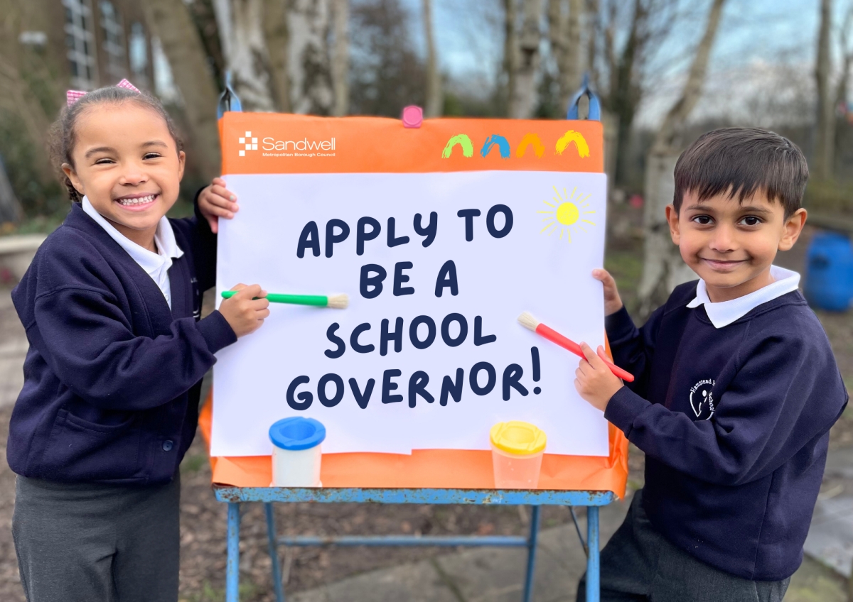 An image of two children holding paintbrushes with the text: Apply to be a school governor!