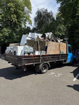 Side view of an overloaded scrap vehicle