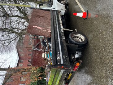 Low back truck loaded with scrap waste