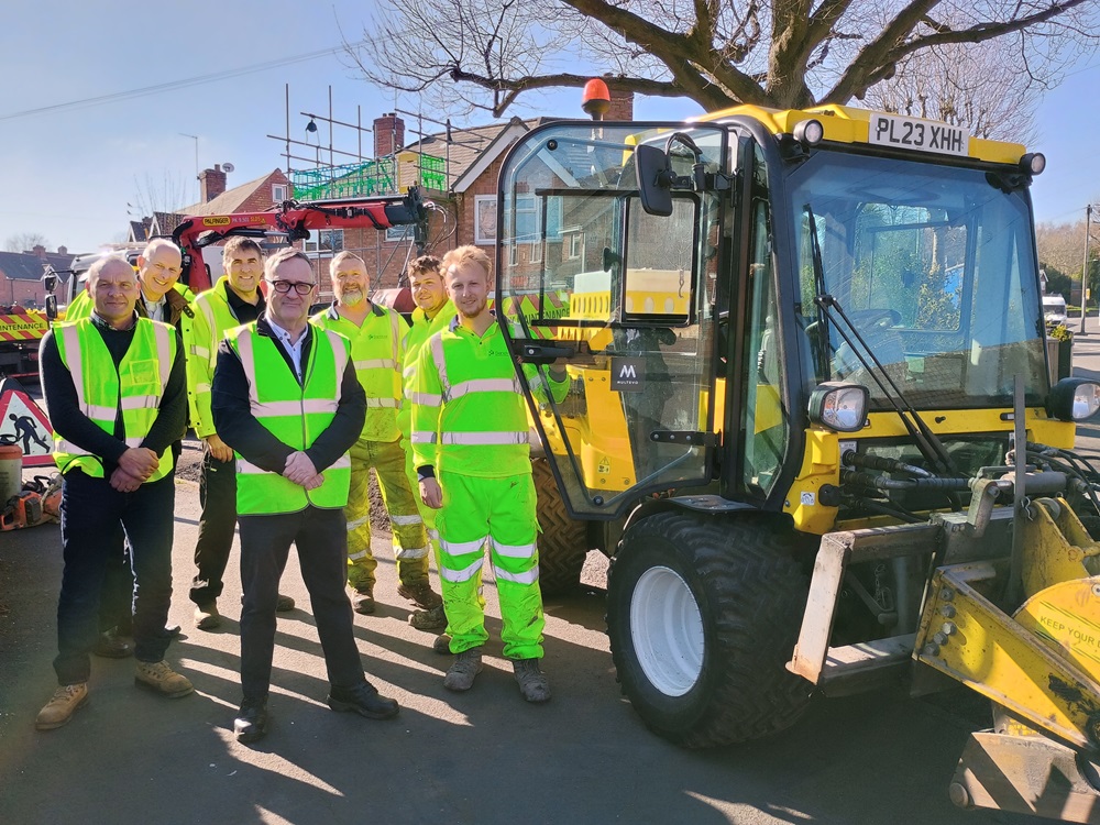Councillor Keith Allcock with highways maintenance team and the Multihog