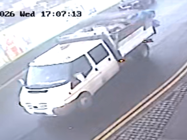 White low back van carrying waste