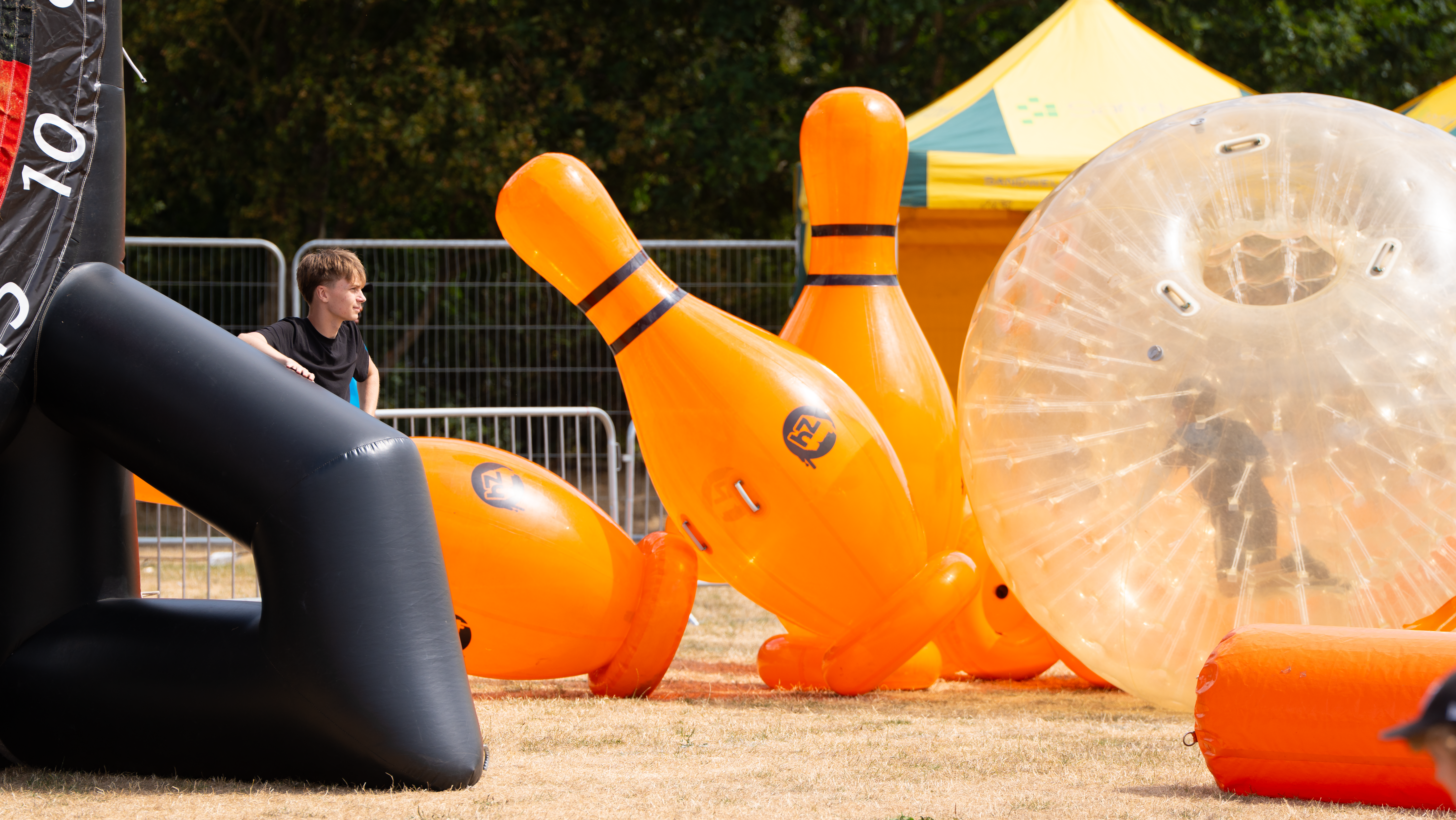 Boy playing with inflatable skittles